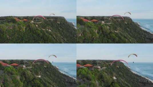 航拍旅游度假区滑翔机飞过海岸高清在线视频素材下载