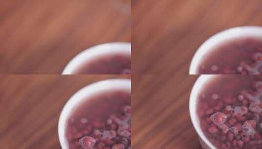 实木桌子上放祛湿红豆粥 (5)高清在线视频素材下载