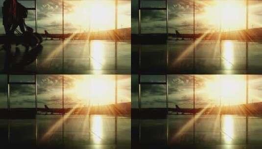 日落时分机场乘客的剪影高清在线视频素材下载