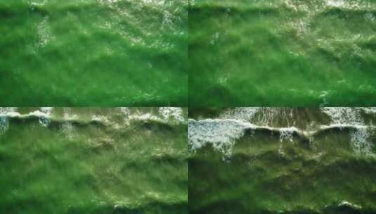 绿色色调的海浪抵达海滩高清在线视频素材下载