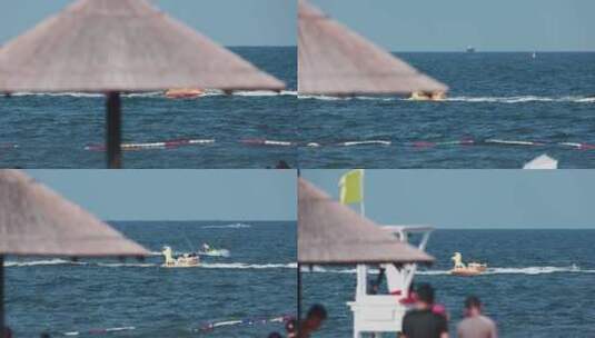 透过人群拍摄海里驰骋的摩托艇高清在线视频素材下载