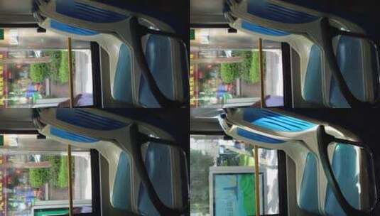 行驶中的公交车和车厢内空座位高清在线视频素材下载