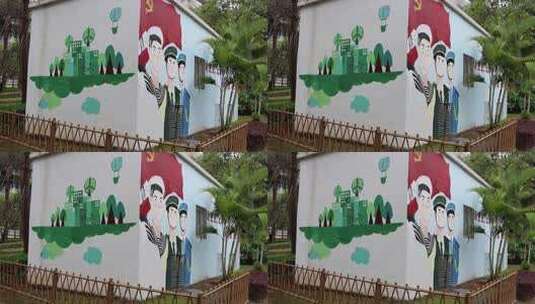 城市街边建筑墙面上的国风绘画和宣传标语4K高清在线视频素材下载