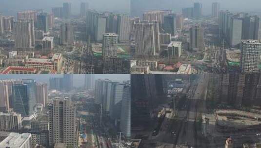 航拍早晨雾霾中的城市高楼和繁忙的公路高清在线视频素材下载
