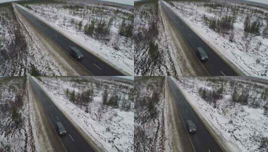 货车在被雪包围的笔直道路上行驶高清在线视频素材下载