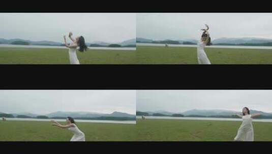白色连衣裙女子在草原上旋转跳舞高清在线视频素材下载