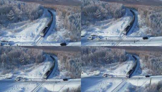 航拍大兴安岭雪原列车高清在线视频素材下载