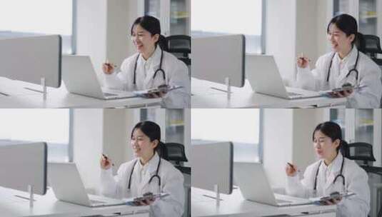 年轻女医生在办公室使用笔记本视频高清在线视频素材下载