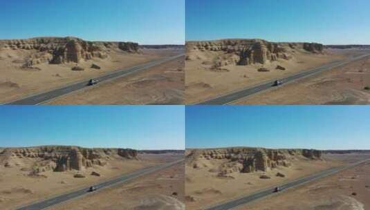 穿越新疆哈密魔鬼城戈壁的公路航拍高清在线视频素材下载