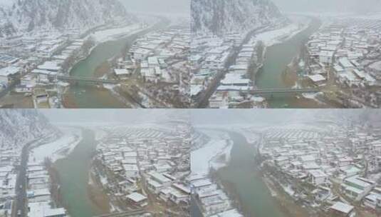 航拍川藏线上的藏主村庄大雪纷飞高清在线视频素材下载