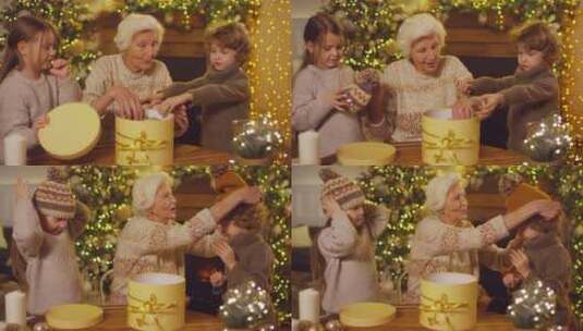 祖母和孙子们在圣诞节打开礼物高清在线视频素材下载