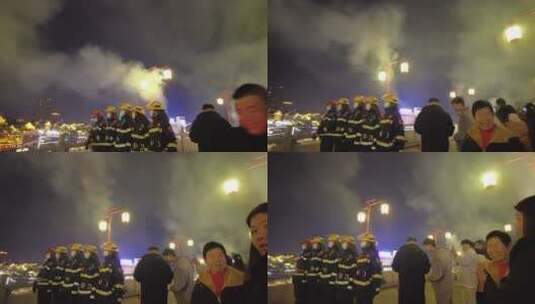 除夕郴州裕后街石拱桥消防员人群烟花燃放高清在线视频素材下载