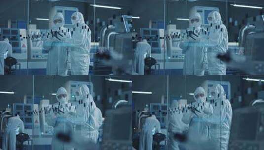 科学家穿着防护服拿着平板在实验室讨论高清在线视频素材下载