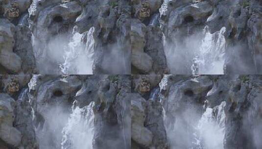 传统中式园林公园内太湖石假山流水瀑布高清在线视频素材下载