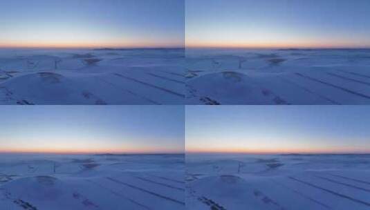 航拍严冬中的辽阔暮色雪原高清在线视频素材下载