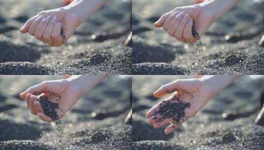手中散落的火山砂细碎鹅卵石高清在线视频素材下载