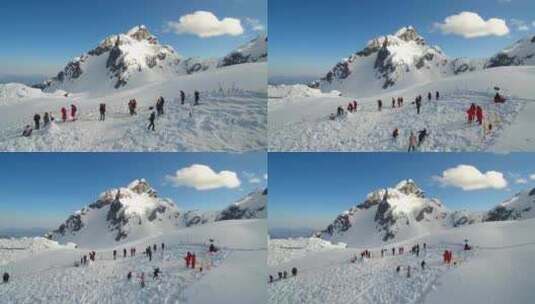 航拍云南丽江玉龙雪山蓝天白云积雪山峰高清在线视频素材下载