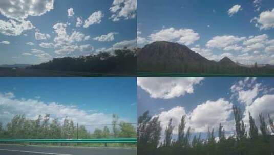 高速公路上行驶汽车车窗外的蓝天白云高清在线视频素材下载