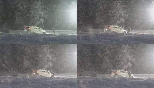 暴雪天气男子清理汽车周边的积雪高清在线视频素材下载