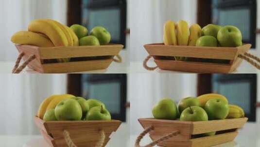 木制篮子，新鲜香蕉和苹果在厨房水果静物上高清在线视频素材下载