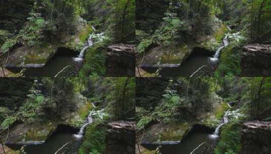 低角度拍摄桂林大山峡谷中的森林瀑布溪流高清在线视频素材下载