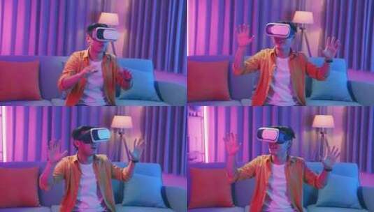 年轻的亚洲男子在客厅探索虚拟现实，青色和高清在线视频素材下载