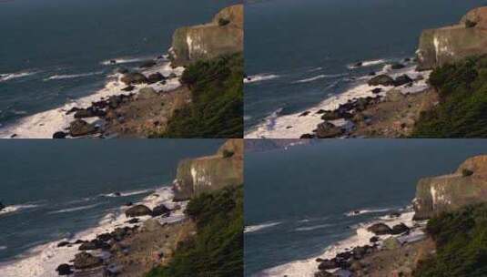 人们在岩石海岸欣赏风景高清在线视频素材下载