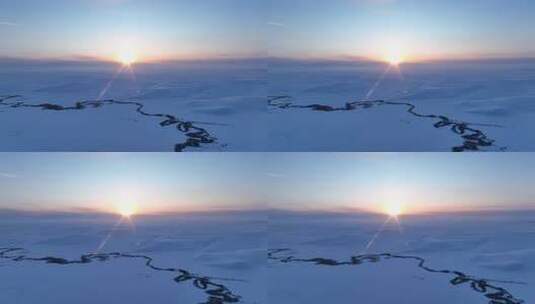 辽阔雪原蜿蜒冰封河流唯美夕阳高清在线视频素材下载