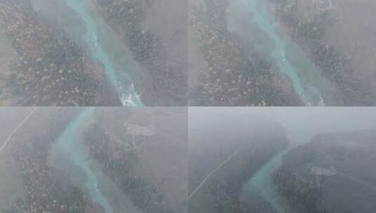 航拍大雪纷飞的新疆喀纳斯河畔秋色高清在线视频素材下载
