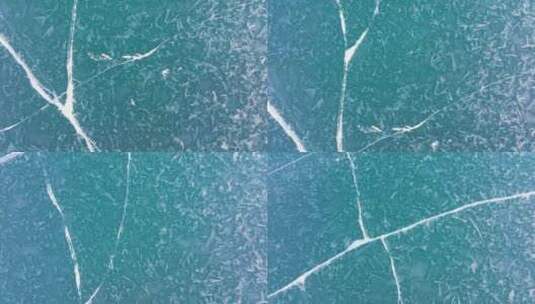 航拍新疆冬季赛里木湖冰封湖面蓝冰美丽纹理高清在线视频素材下载