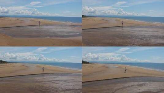 在沙滩上跑步的人航拍镜头高清在线视频素材下载