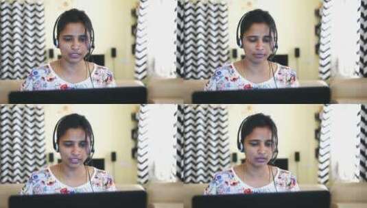 一名印度女人戴着耳机在家工作的特写镜头高清在线视频素材下载