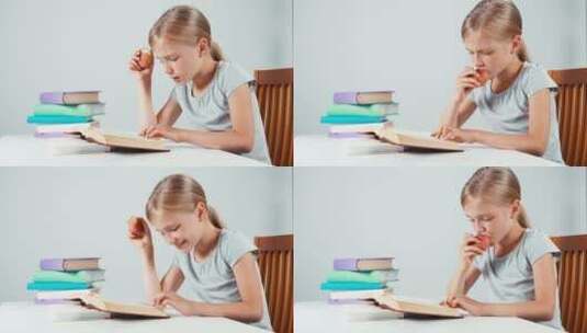 女孩读课本水果高清在线视频素材下载