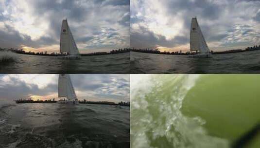 武汉东湖地拍帆船航行人夕阳709高清在线视频素材下载