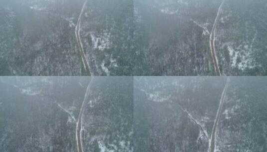 航拍春季极端天气降雪山林公路雾凇高清在线视频素材下载
