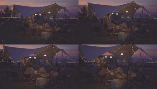 夕阳下露营准备晚餐的一家人高清在线视频素材下载