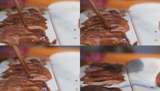 用筷子夹起一块烤鸭鸭肉高清在线视频素材下载