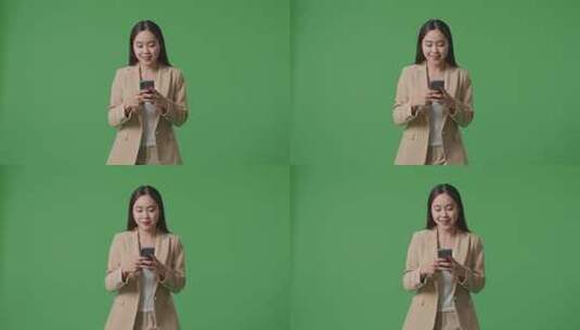 亚洲商务女性使用手机和走在绿屏色度键上高清在线视频素材下载