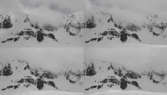 阴天的高海拔落基山脉雪山壁高清在线视频素材下载