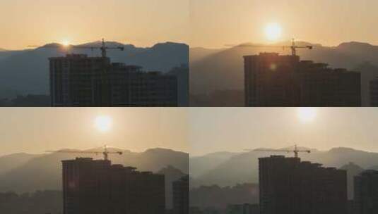 城市摩天大楼建筑工地塔吊上的日出。延时。高清在线视频素材下载