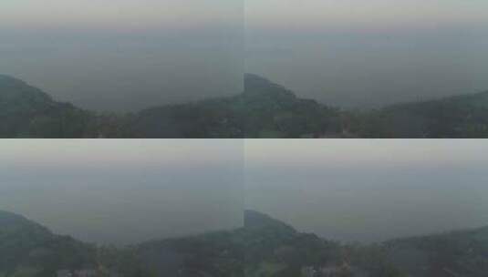 航拍武汉东湖公园清晨大雾水面远处城市高清在线视频素材下载
