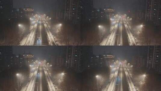 大雪夜景中车来车往的大桥交通景象高清在线视频素材下载