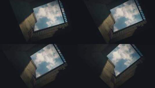 仰拍房屋上的云层高清在线视频素材下载
