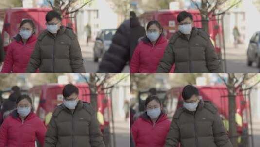 戴着口罩走在街上的男女高清在线视频素材下载