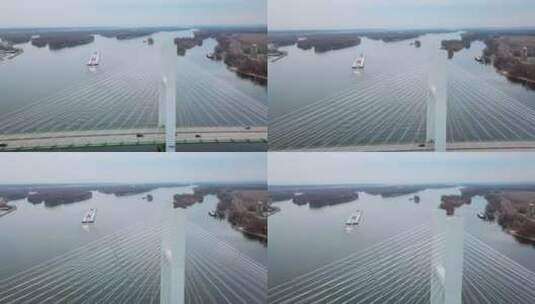 航拍悬索桥上行驶的煤驳船高清在线视频素材下载