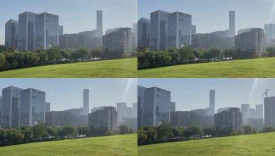 济南高新区城市绿地，高楼大厦中间的小草原高清在线视频素材下载