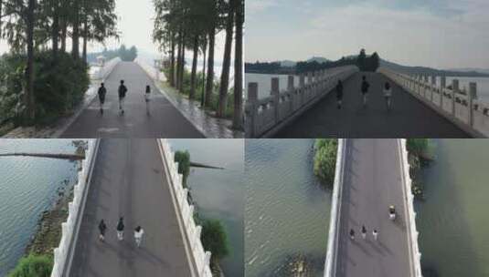 武汉东湖绿道航拍三人跑步模特709高清在线视频素材下载