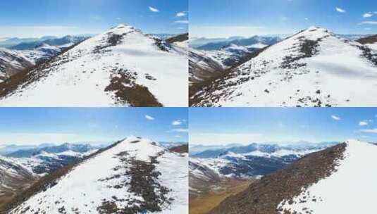 无人机低角度飞过雪山顶航拍夹金山冬季风景高清在线视频素材下载