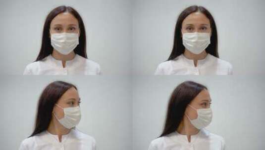女护士摘下她的口罩并微笑高清在线视频素材下载