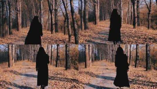 美女行走在落叶的林间小道高清在线视频素材下载